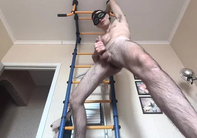 Cock Shaking While Hanging on the Horizontal Bar