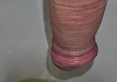 Male Peeing Into the Toilet