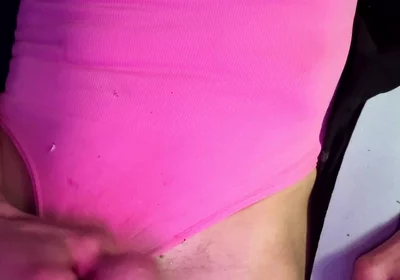 Crossdresser Michelle Wearing Pink Bodysuit While Playing with Cock