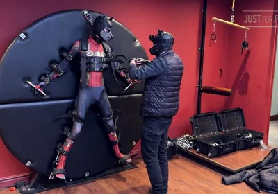 Pup Twink Dressed as Spider-man Strapped to the Bondage Wheel and Milked