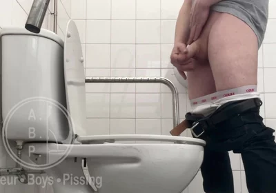 In the Hospital Toilets, a Guy Pisses Into a Cup for a Urine Sample, Then Gets Horny, Jerks-off and Cums