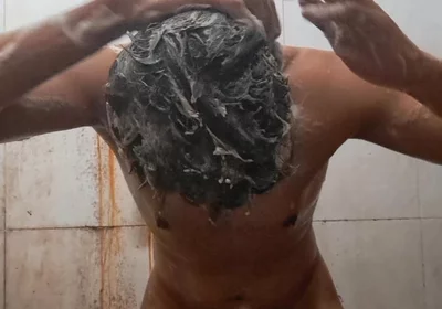 Exotic Skinned Adult Man Taking a Bath in the Afternoon