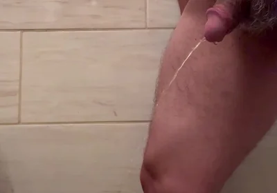 Man Pee in Bathroom