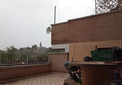 On the Terrace, in the Rain